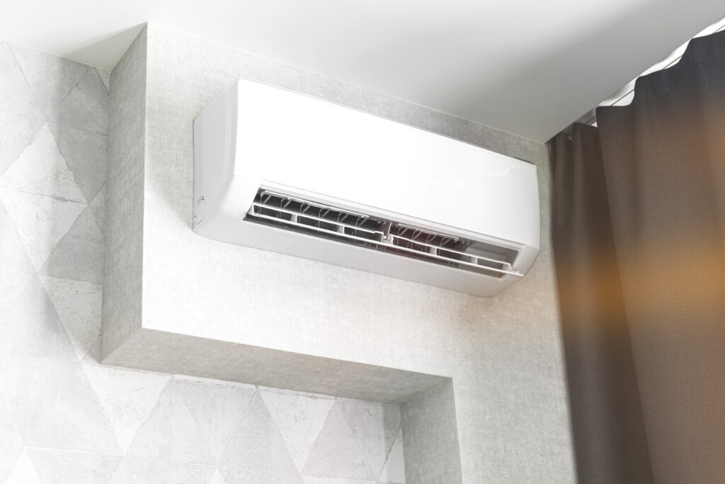 Wall-mounted ductless mini-split on a white wall